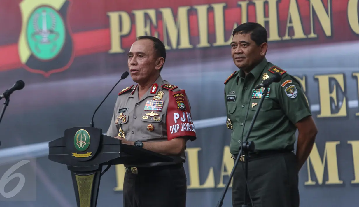 Kapolda DKI Irjen M Iriawan memberikan sambutan didampingi Pangdam Jaya Mayor Jenderal Jaswandi  saat menghadiri deklarasi damai Pilgub DKI Jakarta putaran kedua di Jakarta, Senin (17/4). (Liputan6.com/Faizal Fanani)