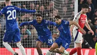 Arsenal harus puas bermain imbang 1-1 kontra Chelsea pada laga pekan ke-11 Premier League di Stamford Bridge, Minggu (10/11/2024) malam WIB. (AFP/Glyn Kirk)