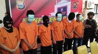Polisi baru tetapkan 8 tersangka dalam kasus perjokian tes CPNS Kemenkumham di Makassar (Liputan6.com/ Eka Hakim)