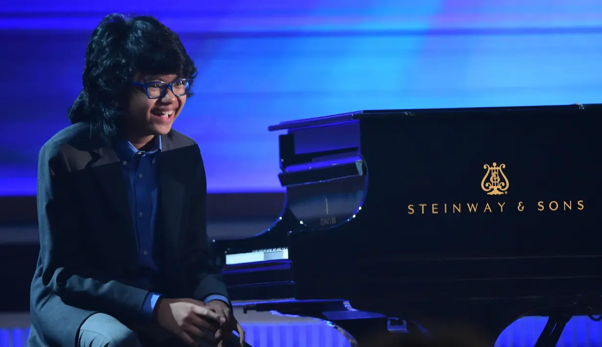 Dapat dinominasikan dalam dua kategori sekaligus di ajang Grammy Awards 2016, Joey Alexander menjadi inspirasi bagi para musisi tanah air khususnya para generasi muda. Ia menjadi motivasi untuk terus berkarya. (AFP/Bintang.com)