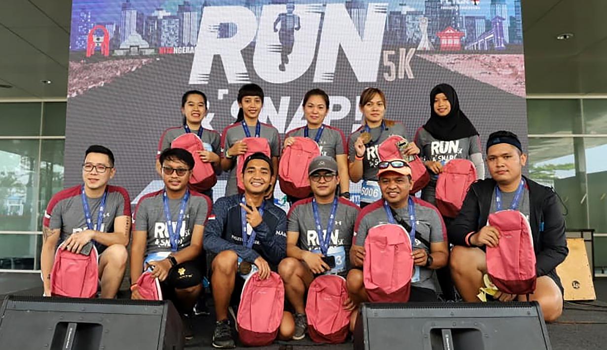 Peserta fun run saat mengikuti event lari bertajuk 'Run and Snap in Tangerang 5k' di Tangerang, Minggu (8/3/2020). Novotel Tangerang gelar event lari yang diikuti ratusan peserta. (Dokumentasi)