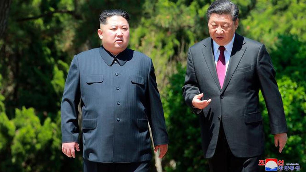 Xi Jinping dan Kim Jong-un