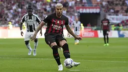 Sempat tertinggal oleh gol cepat Rodrigao Becao di menit 2, Milan membalas lewat penalti Theo Hernandez di menit 11. (AP Photo/Antonio Calanni)