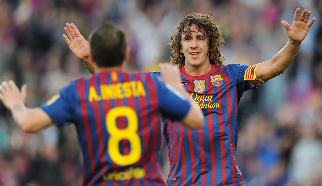 Carles Puyol bergabung dengan Barcelona sejak di akademi La Masia. Ia pun tercatat hanya bermain untuk Blaugrana sepanjang kariernya sebegai pesepak bola. Bek tengah 178 cm ini terkenal solid di lini belakang Barca. Ia juga mampu menyumbang berbagai gelar bergengsi di klub maupun negaranya, Spanyol. (AFP/Lluis Gene)