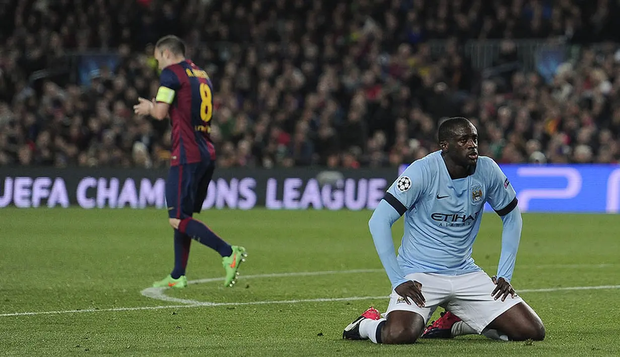 10. Saat di Barcelona, Josep Guardiola, pernah membuang Yaya Toure ke Manchester City. Tentu jika Pep jadi bergabung ke City, posisi gelandang Pantai Gading itu akan kembali terancam. (AFP/Josep Lago) 
