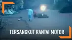 Seorang wanita jatuh dan sempat terseret motor lantaran bajunya yang menjuntai tersangkut rantai motor.