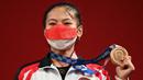 Bukan hanya medali perdana Indonesia, ini juga medali pertama untuk Windy Cantika pada ajang Olimpiade. (Foto: AFP/Vicenzo Pinto)
