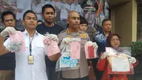 Asisten rumah tangga (ART) yang menganiaya anak majikannya berinisial G (7) di Jelambar, Jakarta Barat akhirnya ditangkap oleh Polres Metro Jakarta Barat. (Winda Nelfira/Liputan6.com)