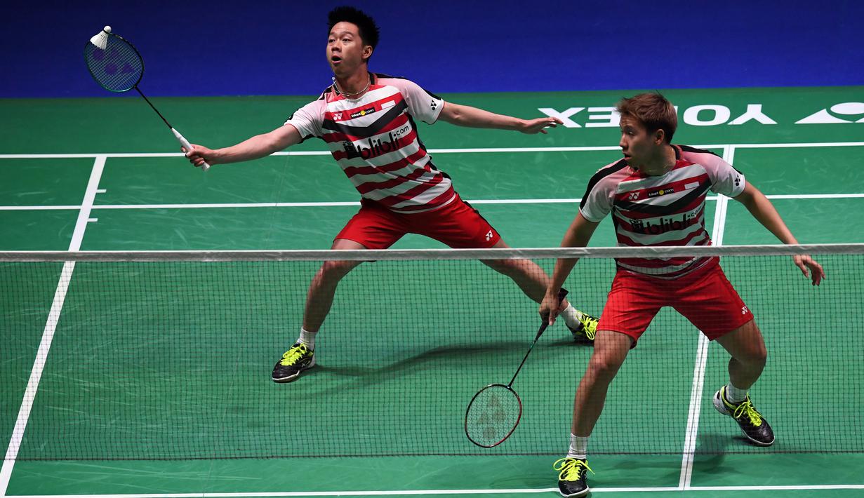 Ganda putra Indonesia, Kevin Sanjaya dan Marcus Gideon saat semifinal All England di Birmingham, Sabtu (18/3/2018). Keduanya tahun ini akan berjuang untuk mempertahankan gelar juara All England. (AFP/Paul Ellis)