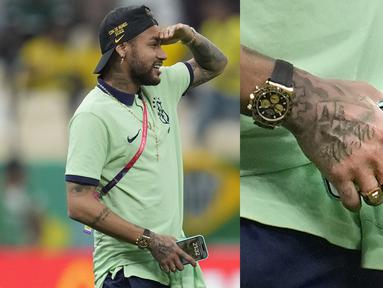 Detail menarik terlihat dari foto Neymar yang tengah menggenggam HP saat laga terakhir Grup G Piala Dunia 2022 antara Brasil melawan Kamerun di Lusail Stadium, Sabtu (03/12/2022) dini hari WIB. (AP/Natacha Pisarenko)