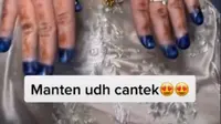 Tampilan hena di tangan pengantin wanita yang menghebohkan. (dok. tangkapan layar TikTok @elin.afiat)