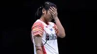 Tunggal putri Indonesia, Gregoria Mariska Tunjung bereaksi setelah kehilangan satu poin melawan pebulu tangkis Taiwan, Tai Tzu Ying pada babak perempat final Piala Sudirman 2019 di Nanning, China, Jumat (24/5/2019). Gregoria Mariska kalah dua gim langsung 16-21, 14-21. (WANG ZHAO/AFP)