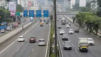 Kendaraan ramai dan lancar ketika melintas di Tol Dalam Kota kawasan Jalan Gatot Subroto, Jakarta, Jumat (23/6). Sejumlah ruas jalan di wilayah Jakarta lancar pagi ini, yang merupakan hari pertama cuti bersama Lebaran 2017. (Liputan6.com/Faizal Fanani)