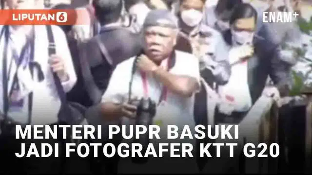 Menteri PUPR Basuki Hadimuljono curi perhatian dalam gelaran KTT G20 di Bali. Berbeda dengan tugas utamanya mengawal pembangunan infrastruktur, kali ini ia menjadi fotografer dengan topinya yang khas. Basuki menenteng kamera dengan lensa tele, menyat...