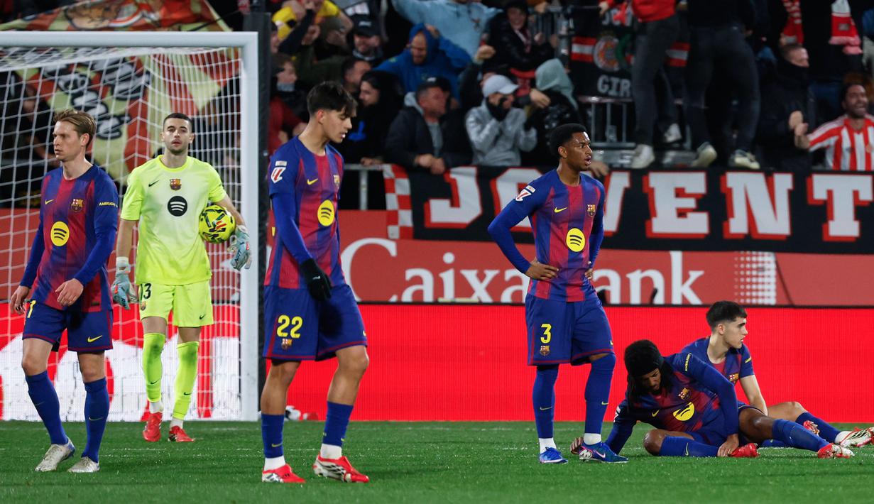 Hasil minor ini tidak hanya menghentikan laju Barcelona, tapi juga menggusur mereka dari puncak klasemen La Liga. (AP Photo/Joan Monfort)