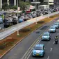 Konvoi taksi listrik jelang jadwal pelaksanaan balap mobil listrik atau Formula E 2020 di kawasan Sudirman, Jakarta, Jumat (20/9/2019). Selain Jakarta, 12 kota di dunia sudah menggelar ajang Formula E. (Liputan6.com/Fery Pradolo)