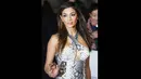 Penyanyi Nicole Scherinzger tampil memakai gaun bermotif ular saat menghadiri pemutaran perdana film 'Selma' di London, Inggris (27/1/2015). (AFP PHOTO/Jack TAYLOR)