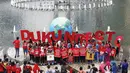 Massa Smoke Free Agent kompak memakai kaos merah saat  aksi  mendukung ratifikasi Kerangka Kerja Pengendalian Tembakau (FCTC) di Bundaran HI, Jakarta, Minggu (15/2/2015). (Antara Foto/ Sigid Kurniawan)