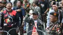 Anggota dan simpatisan Barisan Ansor Serbaguna (Banser) berunjuk rasa menentang keputusan Komisi Pemberantasan Korupsi (KPK) terkait penahanan Menteri Agama periode 2020-2024, Yaqut Cholil Qoumas. Tampak dalam foto, anggota dan simpatisan Barisan Ansor Serbaguna (Banser) saat berunjuk rasa di depan gedung Merah Putih Komisi Pemberantasan Korupsi (KPK), Jakarta, Kamis (12/3/2026). (Liputan6.com/Helmi Fithriansyah)