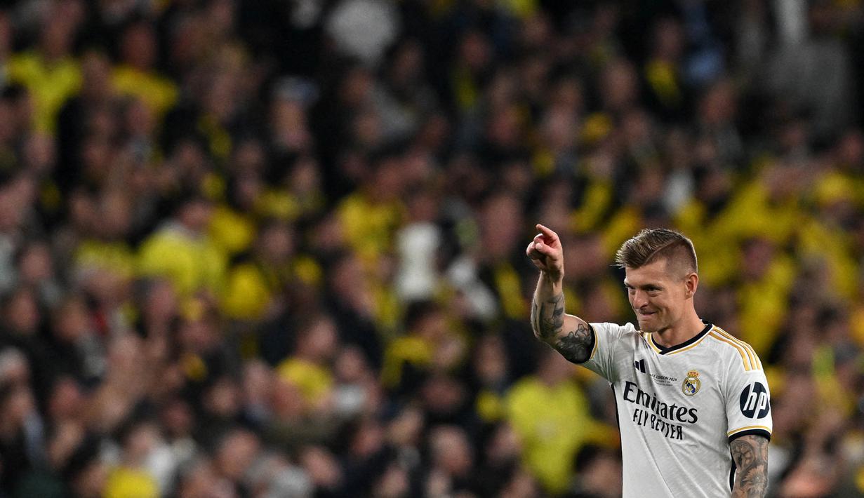 Toni Kross menutup kariernya usai menambah koleksi gelar juara Liga Champions untuk Real Madrid. (Glyn KIRK/AFP)