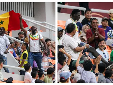 Suporter Senegal beberapa kali mampu mencuri perhatian dari penonton lain saat laga 16 Besar Piala Dunia U-17 2023 antara Timnas Prancis U-17 melawan Timnas Senegal U-17 yang berlangsung di Jakarta International Stadium (JIS), Rabu (22/11/2023). Mereka tak sesekali melakukan aksi kocak seperti datang dengan mengibarkan bendera negaranya sambil membawa galon air mineral hingga menunjukkan kebolehannya melakukan juggling dari tribune. Sayangnya, Timnas Senegal U-17 harus gagal melaju ke babak perempat final setelah kalah dalam babak adu penalti. (Bola.com/Bagaskara Lazuardi)