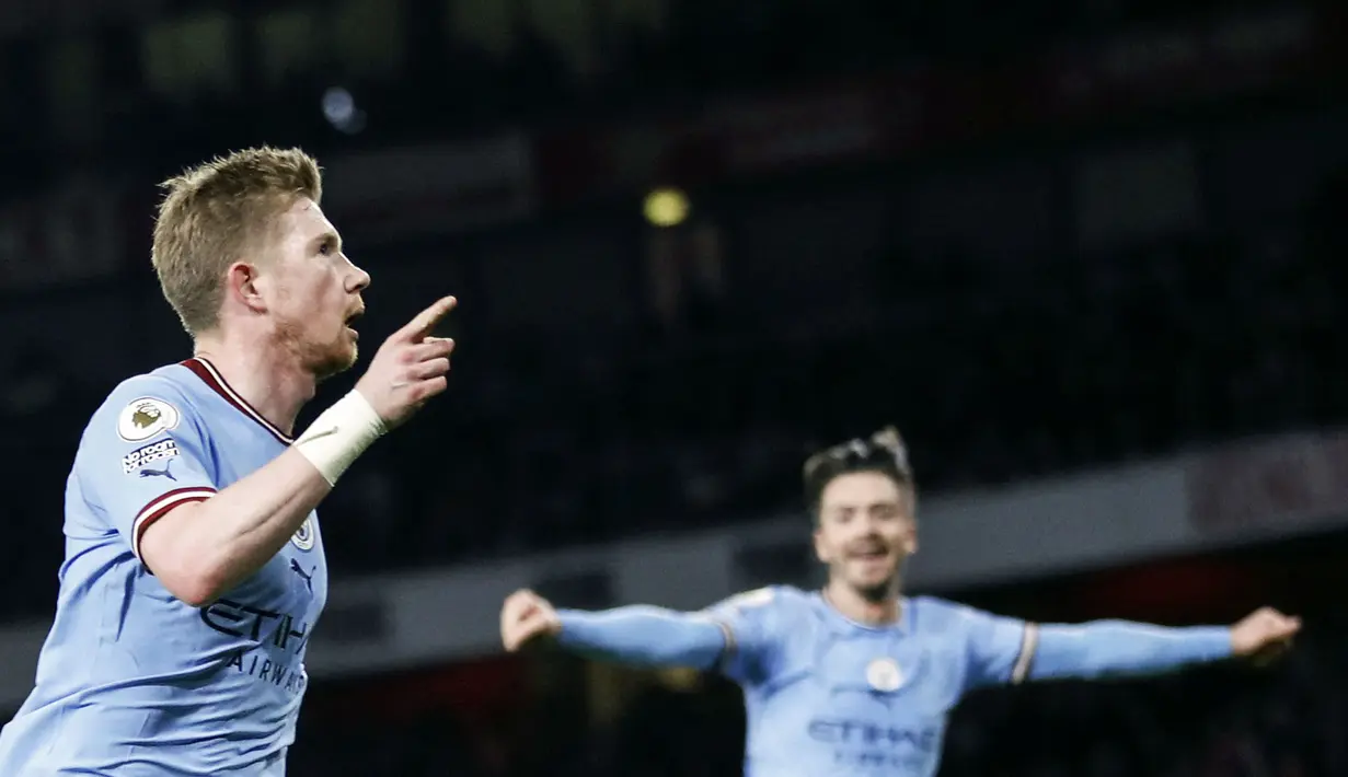 Pemain Manchester City, melakukan selebrasi setelah mencetak gol pertama timnya ke gawang Arsenal pada laga pekan ke-23 Liga Inggris 2022/2023 yang berlangsung di Emirates Stadium, London, Kamis (16/02/2023) WIB. (AFP/Ian Kington)