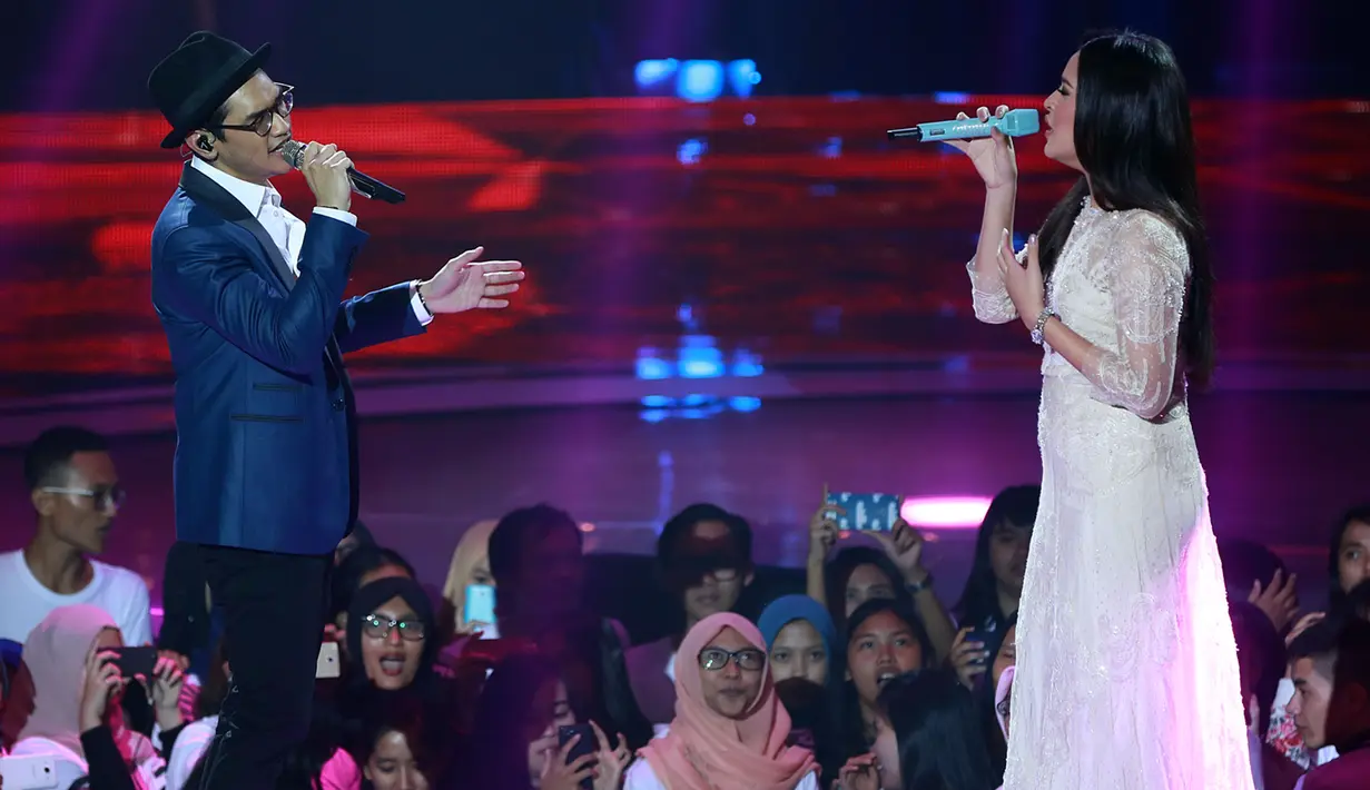 Kehebohan fans saat Afgan dipasangkan dengan Raisa membawakan lagu 'Percayalah'. (Deki Prayoga/Bintang.com)