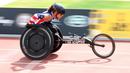 Seorang peserta memacu kursi rodanya di kategori balapan pada ajang Invictus Games Orlando 2016 di ESPN Wide World of Sports complex, (10/5/2016), Lake Buena Vista, Florida. (Alex Menendez/ Getty Images for Invictus Games/AFP)