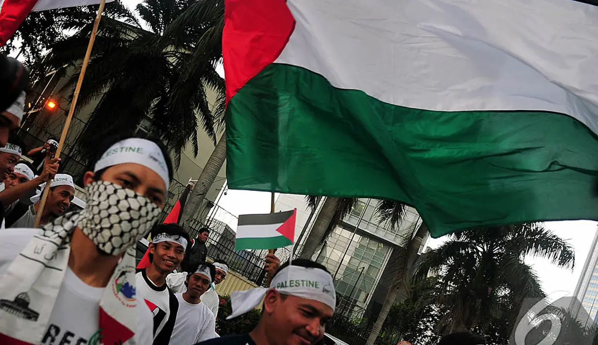 Aksi kepedulian terhadap Palestina di Bundaran HI, Jakarta, Jumat (14/11/2014). (Liputan6.com/Johan Tallo)