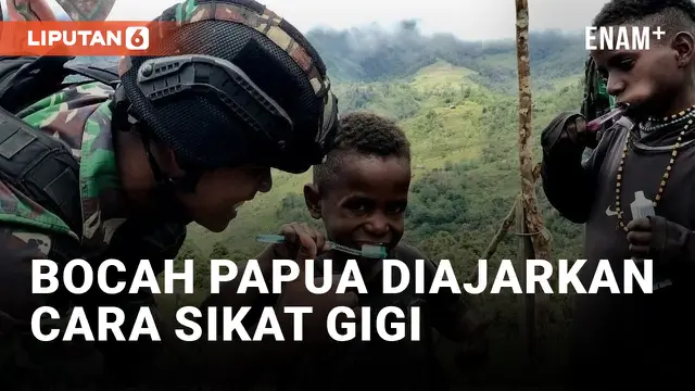 Prajurit TNI Ajarkan Bocah Papua Sikat Gigi yang Benar