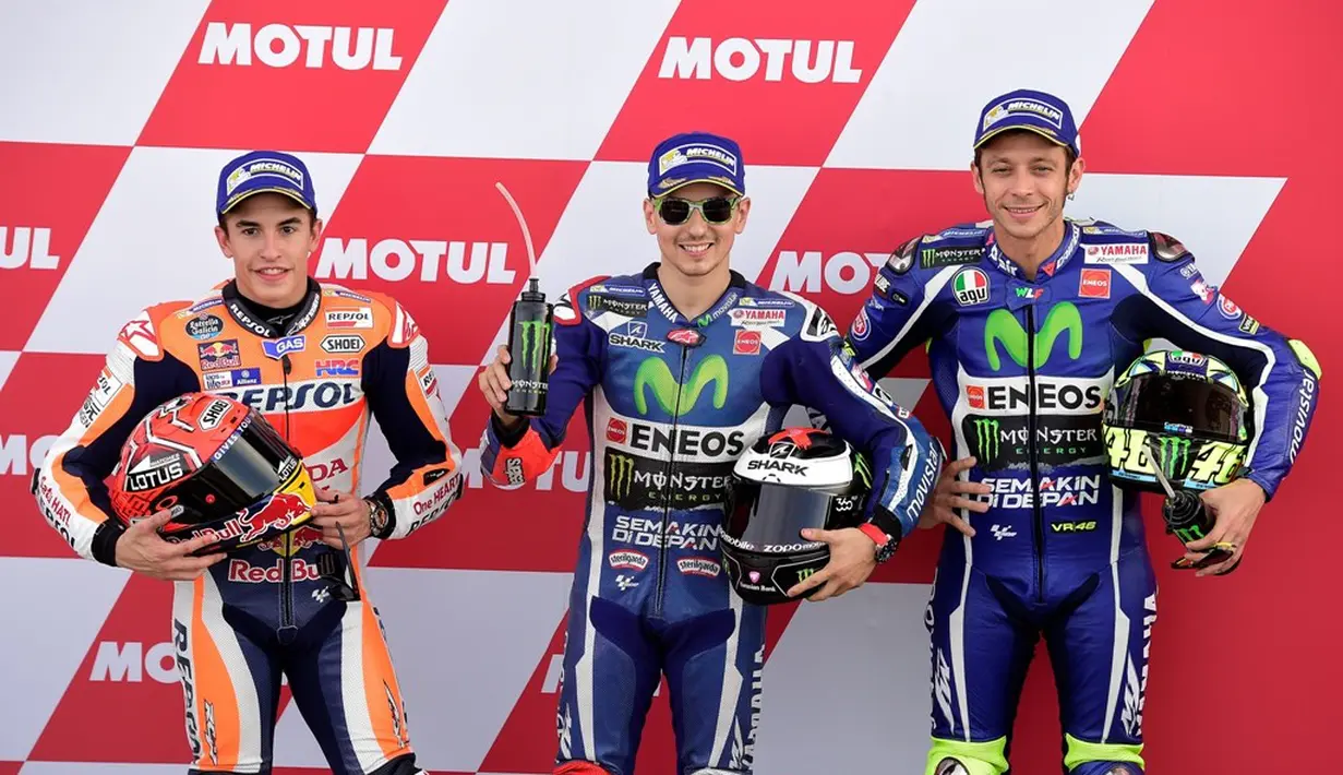 Marc Marquez, Jorge Lorenzo, dan Valentino Rossi akan start di barisan depan saat balapan MotoGP Valencia di Sirkuit Ricardo Tormo, Minggu (13/11/2016). (AFP/Jose Jordan)