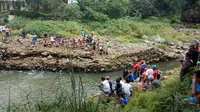 Seorang pemuda menghilang setelah terseret arus Sungai Ciliwung, Kelurahan Bantarjati, Kecamatan Bogor Utara, Kota Bogor, Sabtu (15/7/2017) pagi.