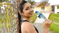 Ilustrasi minum setelah olahraga. (Photo by Alexis Maxell on Unsplash)