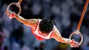 Pesenam putra Jepang, Kiichi Kaneta beraksi dalam nomor gelang-gelang pada babak kualifikasi Kejuaraan Dunia Gimnastik 2025 di Indonesia Arena, Senayan, Jakarta, Minggu (19/10/2025). (Bola.com/Bagaskara Lazuardi)