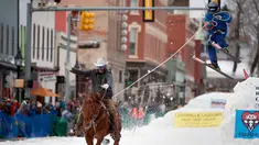 Joki kuda menarik pemain ski salju yang melompat saat mengikuti kompetisi Leadville Ski Joring ke-70 di Leadville, Colorado (4/3). Ski joring ini adalah olahraga yang berasal dari Skandinavia dan telah diadaptasi di Leadville. (AFP Photo/Jason Connolly)