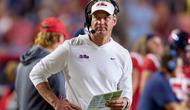 Ole Miss head coach Lane Kiffin faces a major decision regarding his future, with intense speculation pointing to a lucrative offer from LSU and a delayed announcement raising questions.