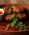 Dengan tambahan sayuran, keju, dan bumbu favorit, nugget buatan sendiri bisa menjadi pilihan menu yang lebih variatif untuk keluarga. (Foto/Dok: Pexels)