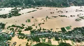 Provinsi Nghe An, sebuah wilayah yang membentang dari pesisir hingga perbatasan pegunungan Laos, di Vietnam bagian tengah-utara menjadi salah satu daerah yang paling parah dilanda hujan lebat dan banjir akibat Badai Tropis Wipha. (Foto oleh AFP)