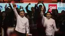 Pasangan calon gubernur-wakil gubernur DKI Jakarta nomor urut dua Dharma Pongrekun (kiri) dan Kun Wardana saat debat kedua Pemilihan Gubernur DKI Jakarta pada Pemilihan Kepala Daerah (Pilkada) Serentak 2024 di Beach City International Stadium, kawasan wisata Ancol, Jakarta Utara, Minggu (27/10/2024). (Liputan6.com/Angga Yuniar)