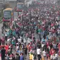 Ribuan warga melakukan olah raga saat Car Free Day di Bundaran HI, Jakarta,  Minggu (4/10/2015). Minggu pertama CFD di awal bulan ini dimanfaatkan warga Jakarta maupun dari luar Jakarta untuk berolah raga.(Liputan6.com/Angga Yuniar)