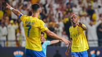 Pemain Al Nassr, Talisca (kanan), melakukan selebrasi setelah mencetak gol ke gawang Istiklol dalam laga kedua Grup E Liga Champions Asia 2023/2024 yang berlangsung di Al Awal Park at King Saud University, Riyadh, Selasa (3/10/2023) dini hari WIB. (X/Al Nassr FC)