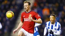 Jonny Evans bermain cukup tangguh mengawal lini belakang MU. Ia juga rajin membantu serangan. (AFP/Paul Ellis)