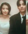 IU Kenakan Veil Dibalut Gaun Pernikahan Putih saat Jadi &ldquo;Pengantin&rdquo; Bersama V BTS. &nbsp;[YouTube/ IU Official]