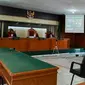 Sidang virtual Bupati Bengkalis non aktif Amril Mukminin di Pengadilan Tipikor Pekanbaru. (Liputan6.com/M Syukur)