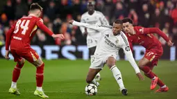 Bermain kandang, The Reds sukses membekuk juara bertahan Liga Champions, Real Madrid dengan skor 2-0. (Oli SCARFF/AFP)