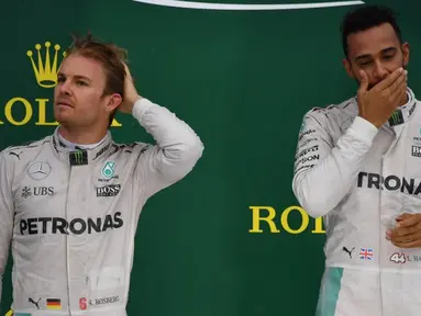 F1 2016 menjadi arena pertarungan sengit duo Mercedes, Nico Rosberg dan Lewis Hamilton. Seri terakhir, GP Abu Dhabi, yang akan dihelat 27 November 2016 akan menjadi ajang penentuan gelar juara dunia. (AFP/Nelson Almeida)
