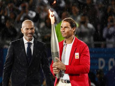 Upacara Pembukaan Olimpiade Paris 2024 berlangsung meriah di Sungai Seine, Prancis, pada Sabtu (27/7/2024) dini hari WIB. (AFP/Jeff Pachoud)