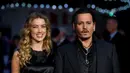 Amber Heard mengaku mencintai peran ibu tiri bagi dua anak Johnny Depp. (AFP/Bintang.com)
