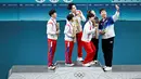 Foto-foto pemain tenis meja Olimpiade Paris 2024 dari Korea Utara dan Korea Selatan yang berswafoto bersama di podium medali menjadi viral di Negeri Ginseng pada hari Rabu. (WANG Zhao / AFP)