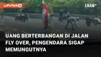 Fenomena uang terbang terjadi di jalan fly over viral di media sosial